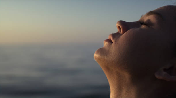 Seated person practicing slow evening breathing